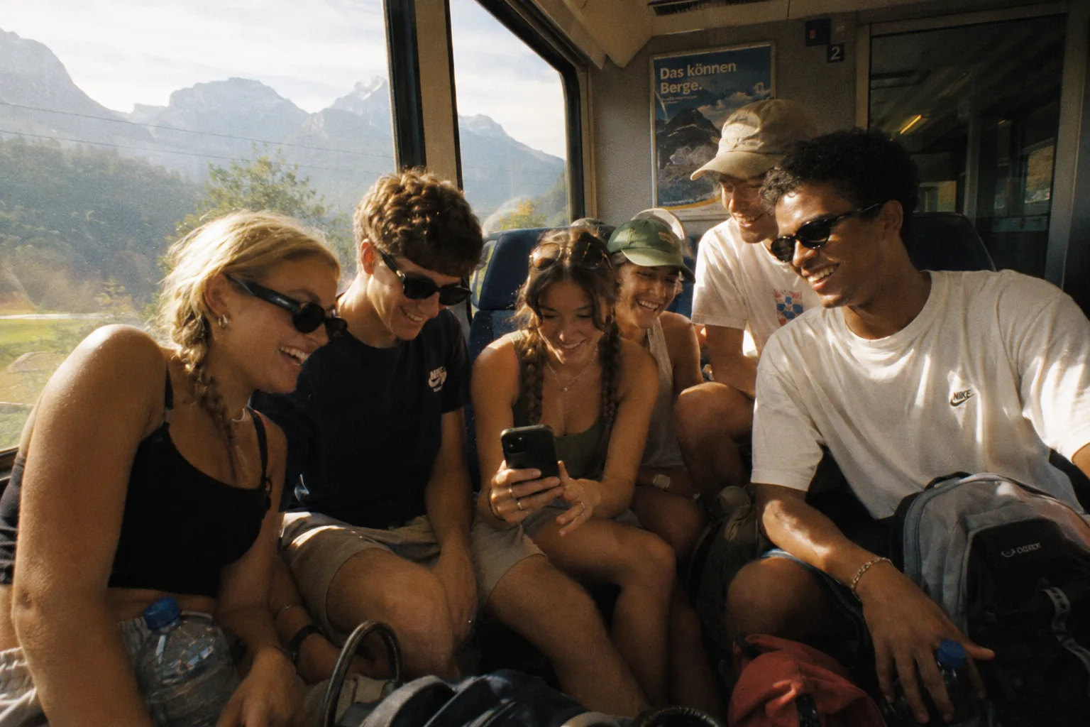 Friends laughing together on the train home